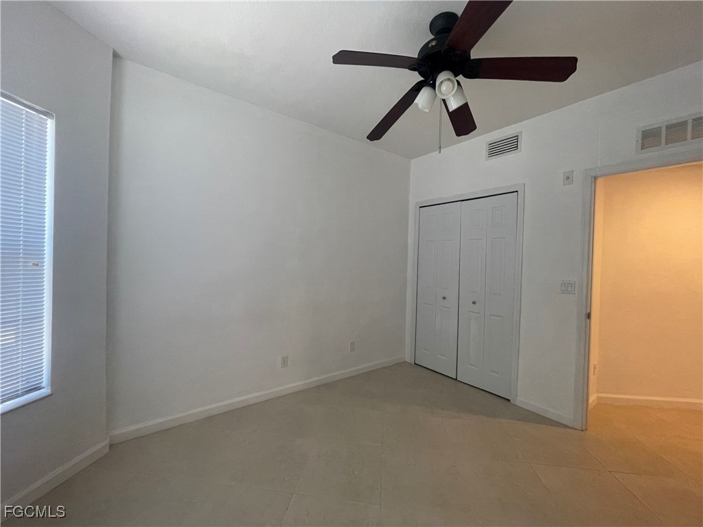 8416 Bernwood Cove Loop, Unit 1611 Fort Myers, FL 33966 - Photo 15 of 50 a view of room with a ceiling fan and window