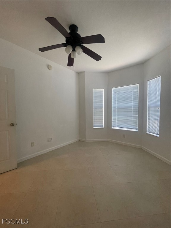 8416 Bernwood Cove Loop, Unit 1611 Fort Myers, FL 33966 - Photo 17 of 50 an empty room with a window and a fan