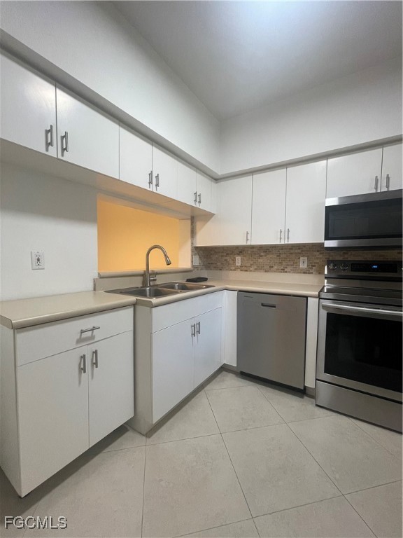 8416 Bernwood Cove Loop, Unit 1611 Fort Myers, FL 33966 - Photo 34 of 50 a kitchen with cabinets appliances and a sink