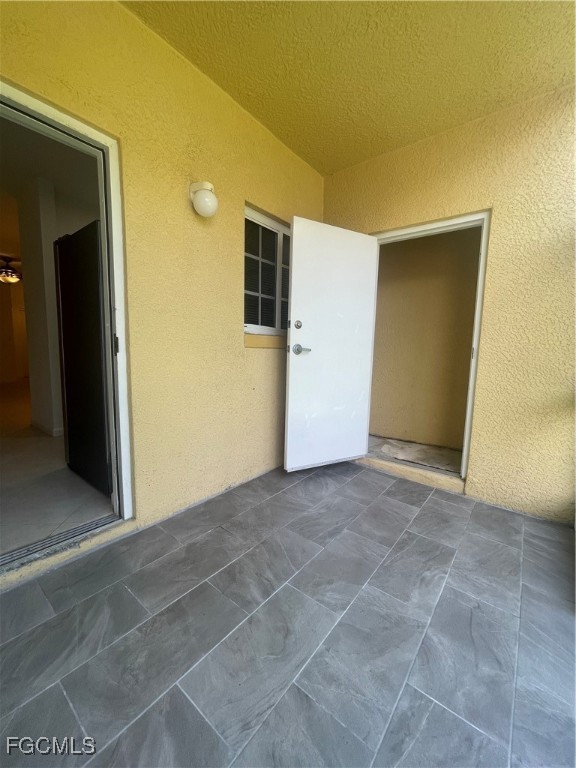 8416 Bernwood Cove Loop, Unit 1611 Fort Myers, FL 33966 - Photo 43 of 50 a view of a big room with closet and a hallway