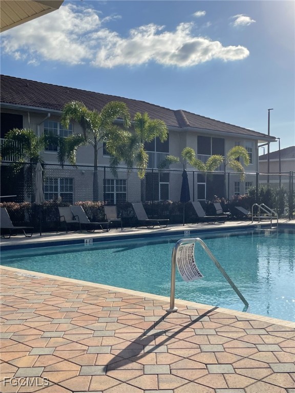8416 Bernwood Cove Loop, Unit 1611 Fort Myers, FL 33966 - Photo 50 of 50 a view of a swimming pool with a patio