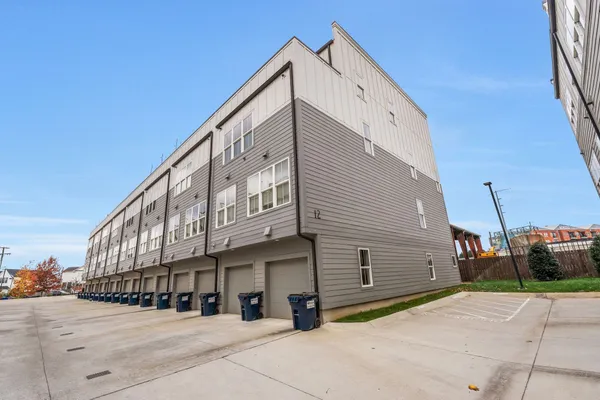 a view of a white building with many windows