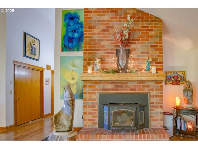 a view of living room with furniture and a fireplace