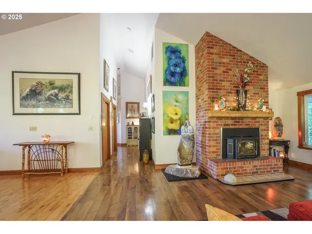 a view of a livingroom with furniture and a fireplace