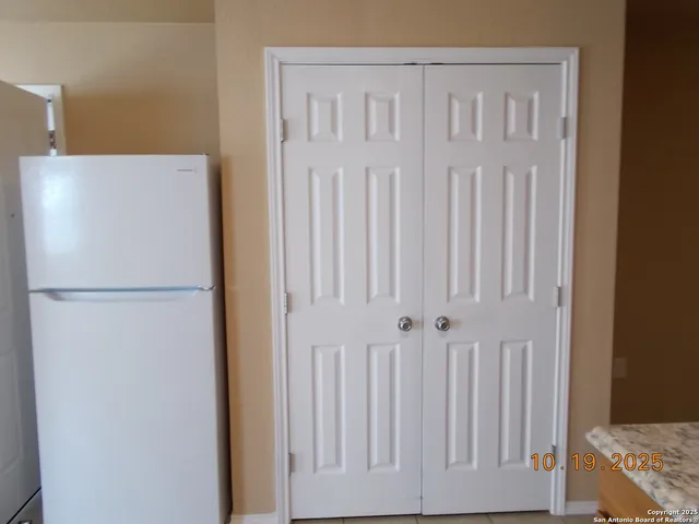 a white refrigerator freezer and a dishwasher