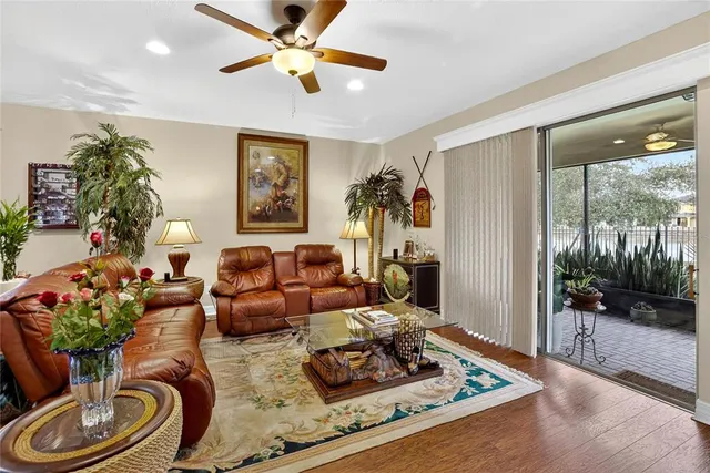 a kitchen with stainless steel appliances granite countertop a sink dishwasher and stove with wooden floor