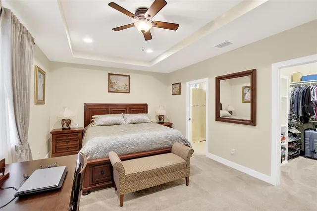 a bathroom with a granite countertop sink a toilet and a mirror