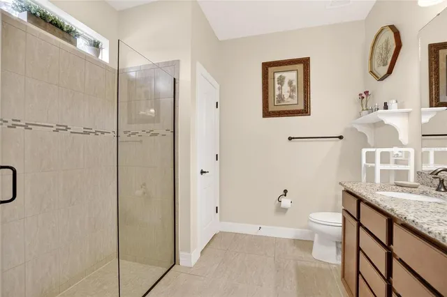 a living room filled with furniture and a potted plant