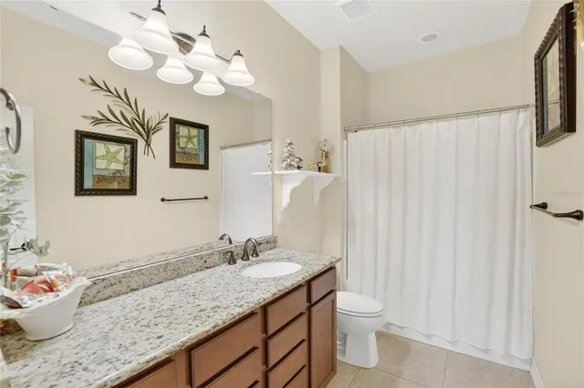 an aerial view of a house with a lake view