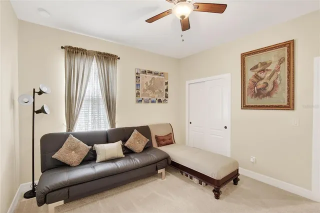 an aerial view of a house with a garden and lake view