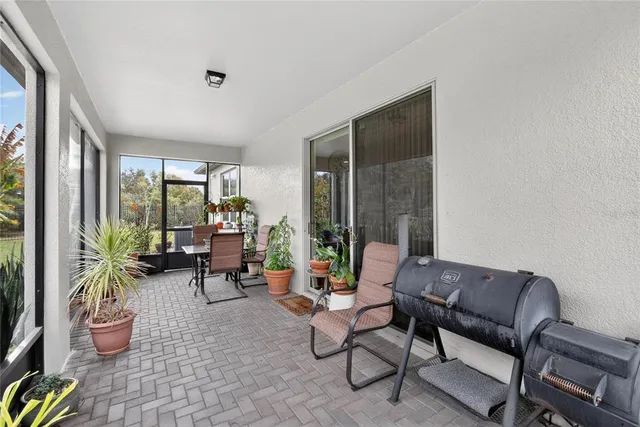 an aerial view of a house with outdoor space and lake view