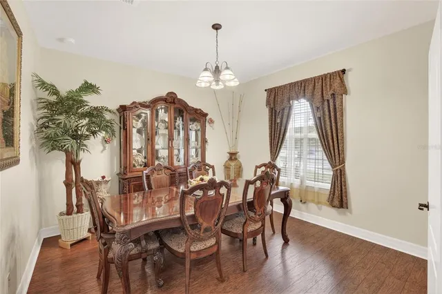 a living room with furniture a fireplace and wooden floor