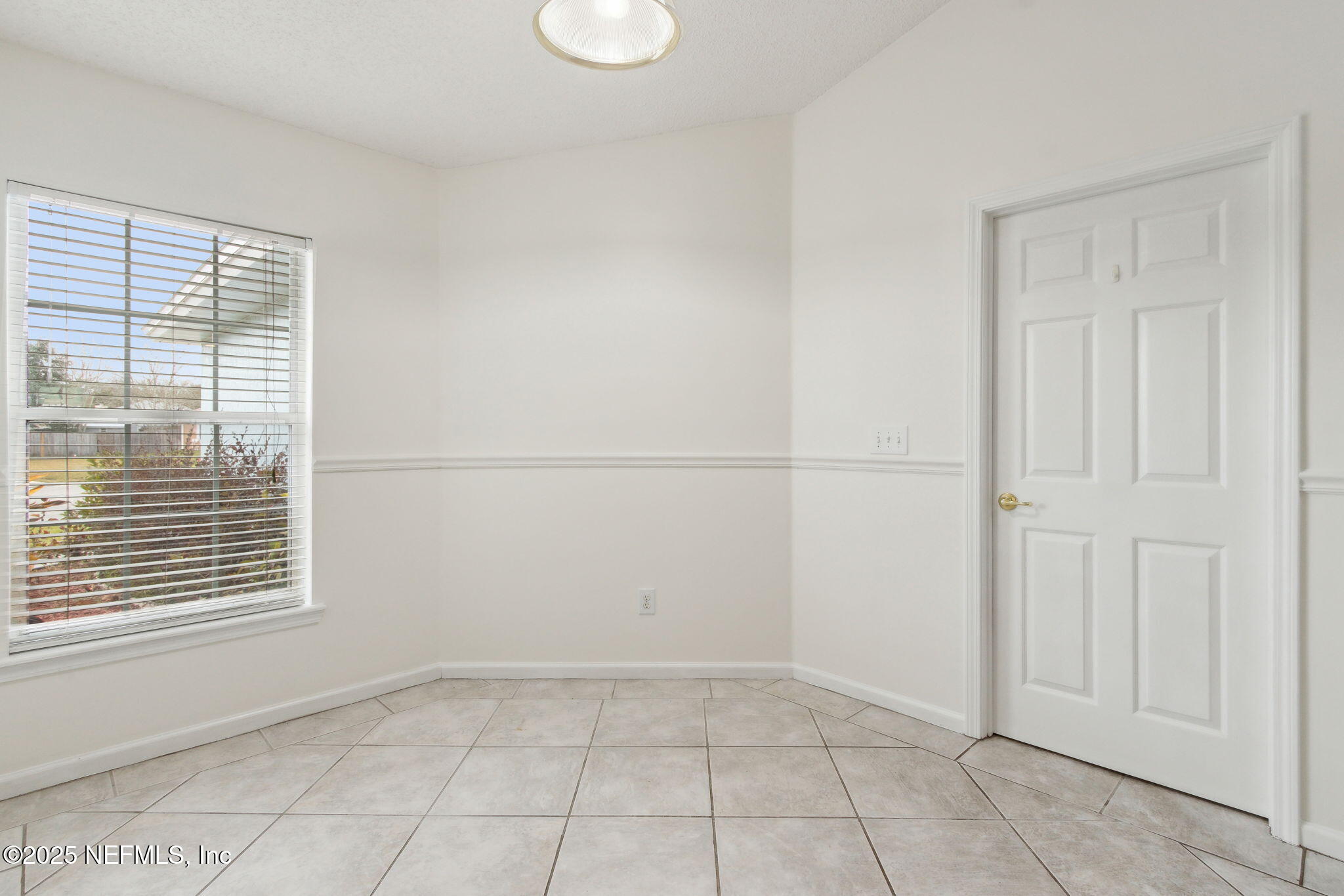 2005 Frogmore Drive Middleburg, FL 32068 - Photo 11 of 43 a view of an empty room with a window