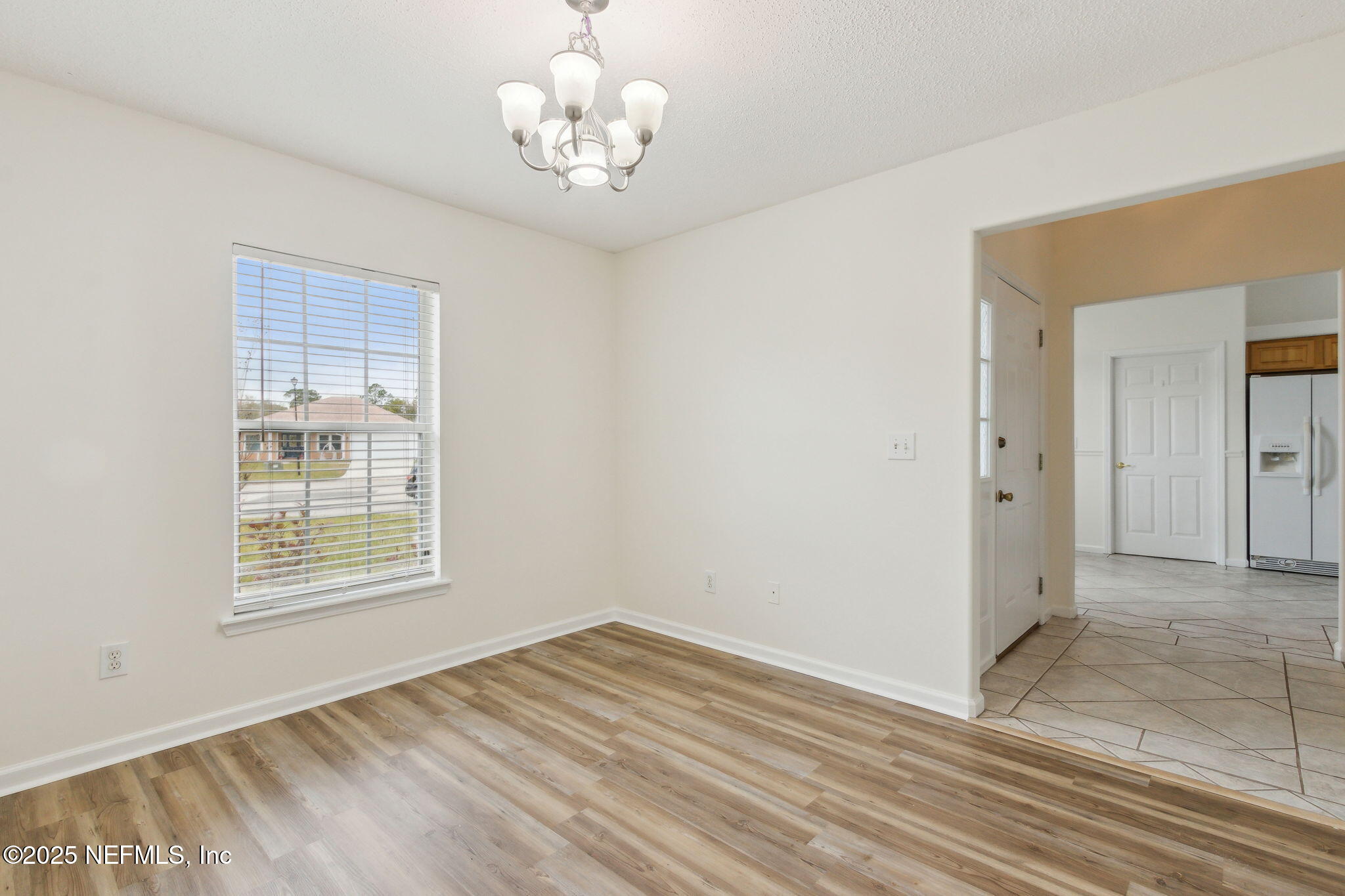 2005 Frogmore Drive Middleburg, FL 32068 - Photo 23 of 43 a view of an empty room with wooden floor and a window