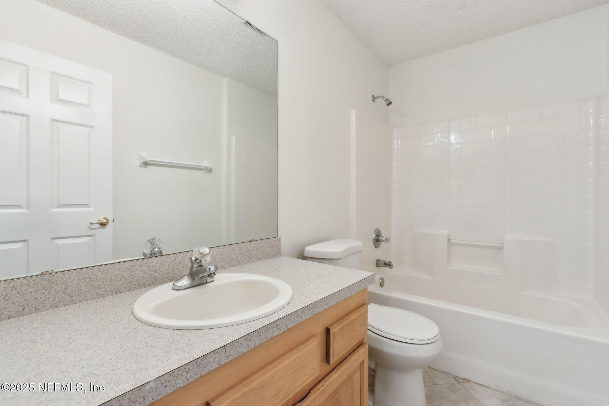 2005 Frogmore Drive Middleburg, FL 32068 - Photo 24 of 43 a bathroom with a toilet a sink and a bathtub