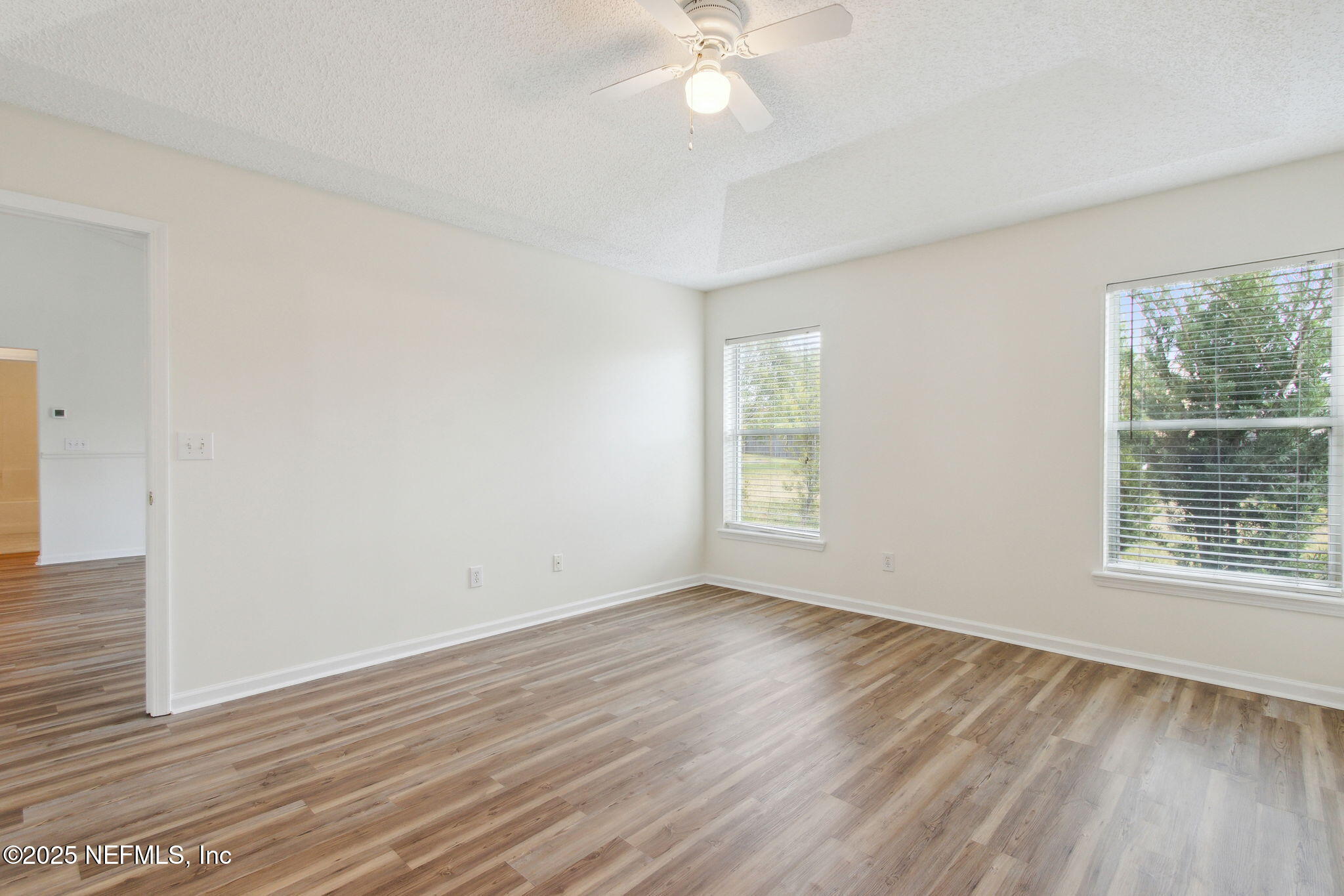 2005 Frogmore Drive Middleburg, FL 32068 - Photo 28 of 43 a view of an empty room with wooden floor and a window