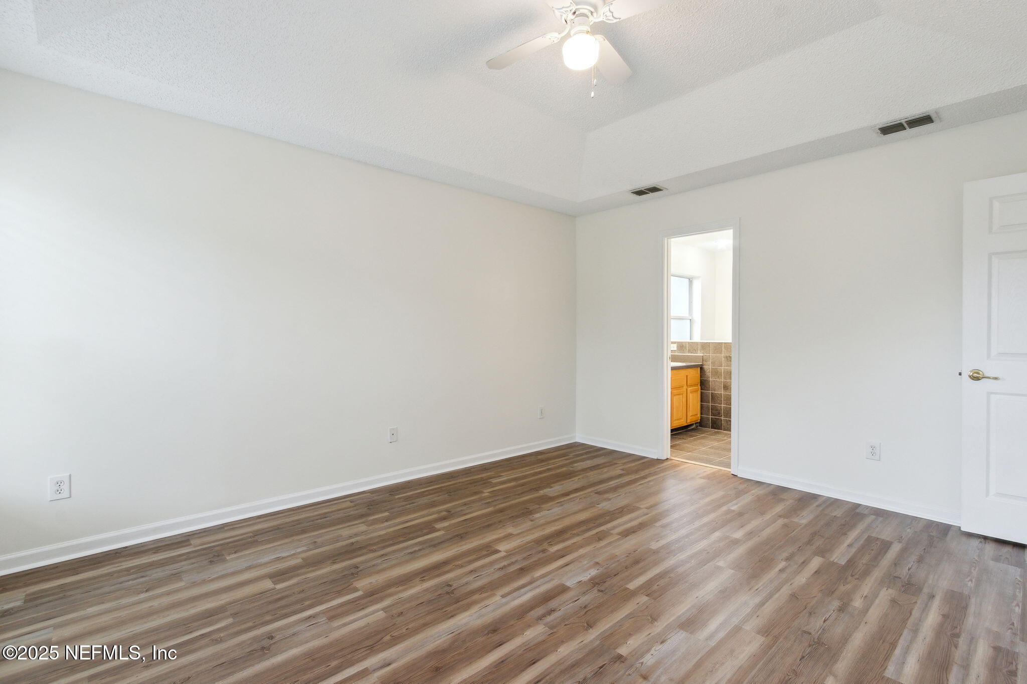 2005 Frogmore Drive Middleburg, FL 32068 - Photo 29 of 43 a view of an empty room with wooden floor and a window