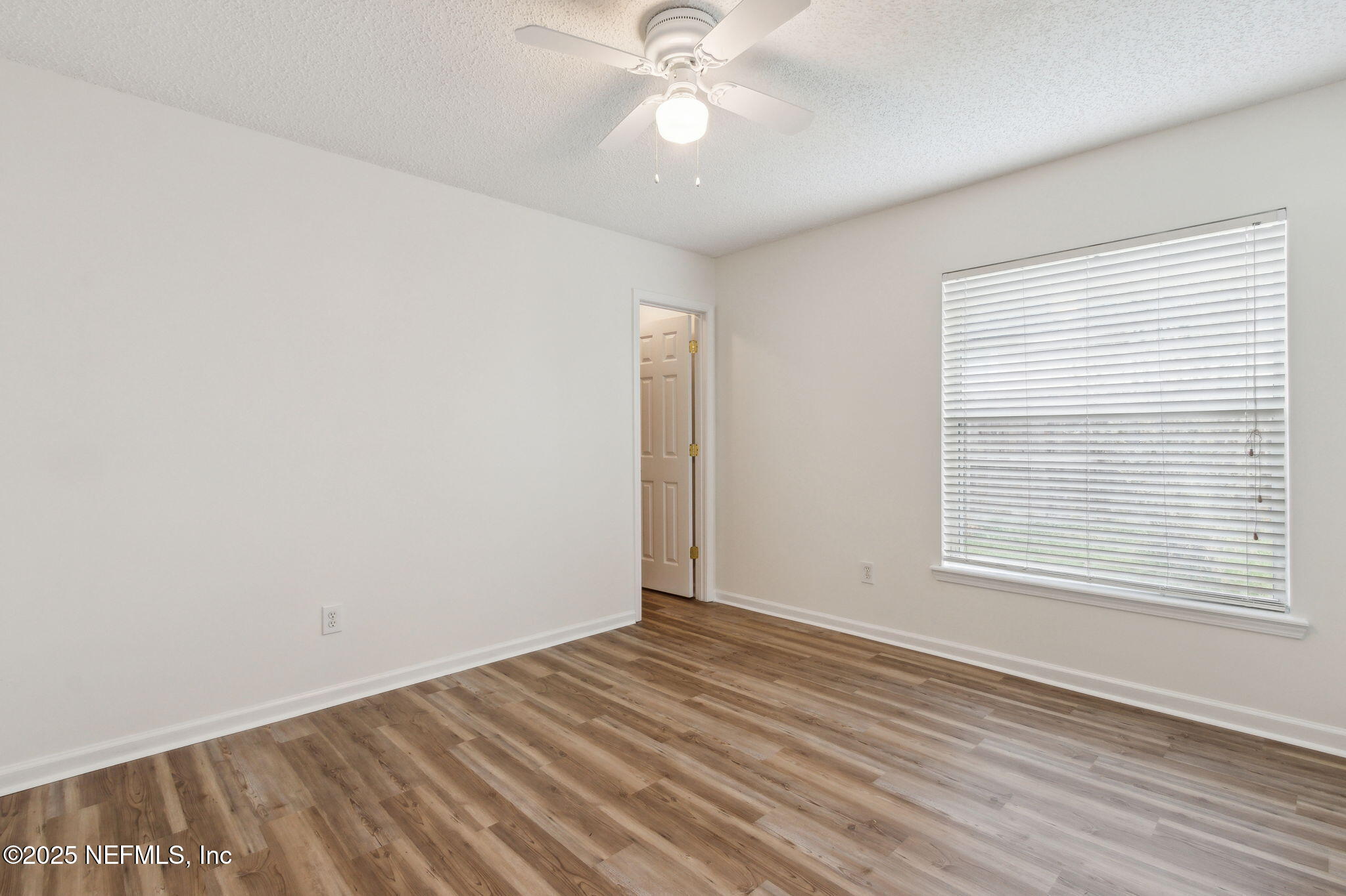 2005 Frogmore Drive Middleburg, FL 32068 - Photo 34 of 43 wooden floor in an empty room with a window