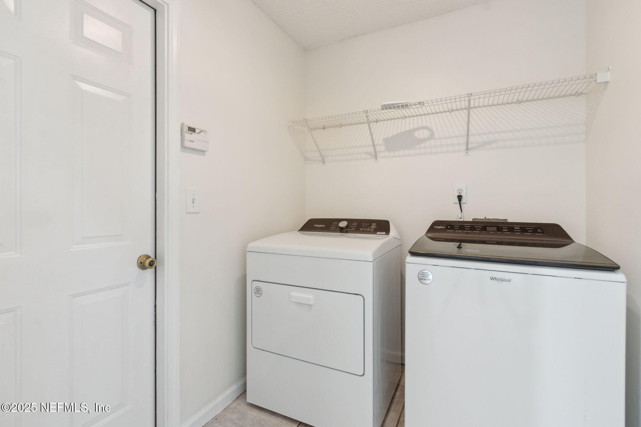 2005 Frogmore Drive Middleburg, FL 32068 - Photo 37 of 43 a utility room with dryer and washer