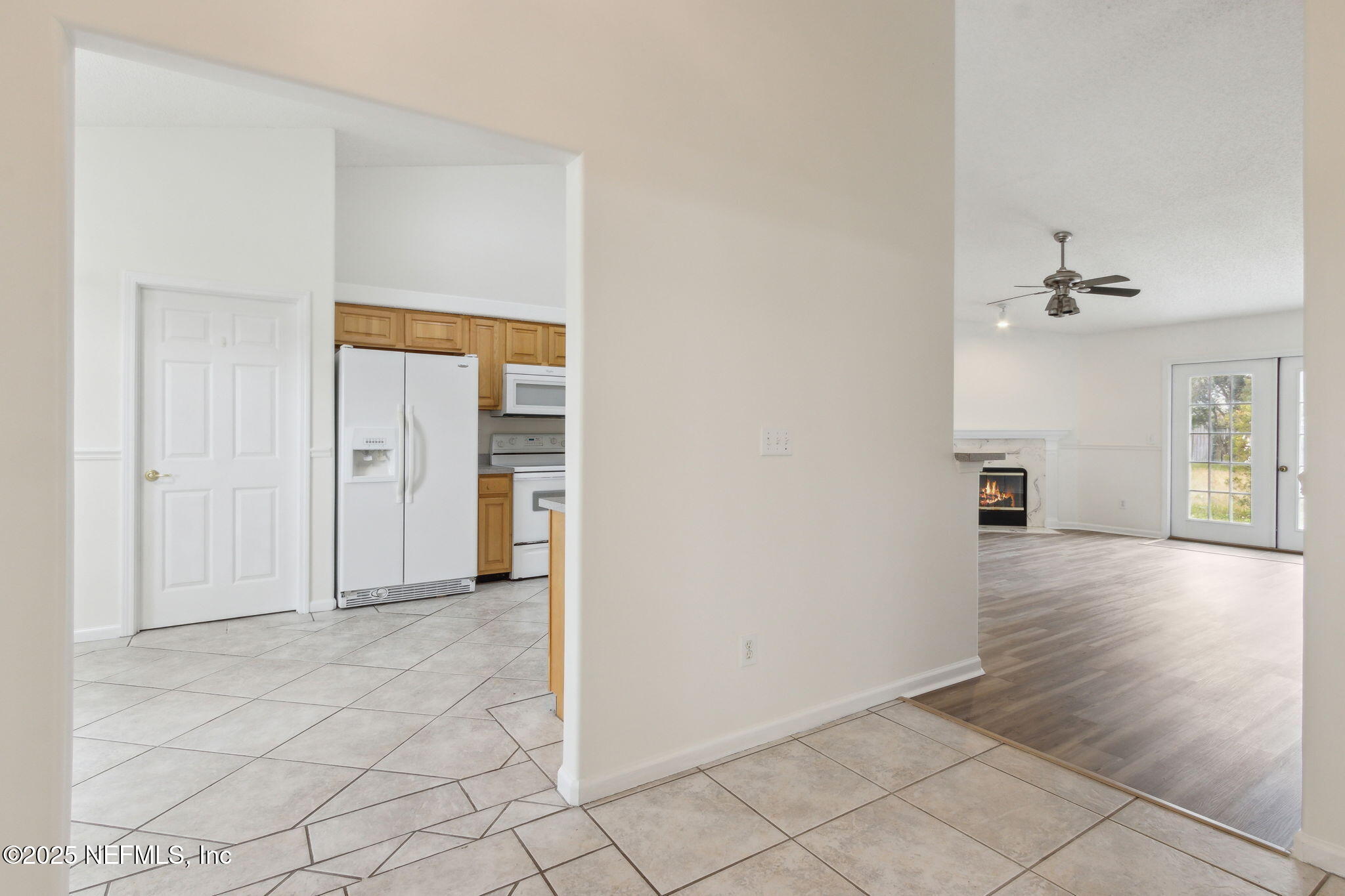 2005 Frogmore Drive Middleburg, FL 32068 - Photo 10 of 43 a view of a livingroom with wooden floor and a chandelier