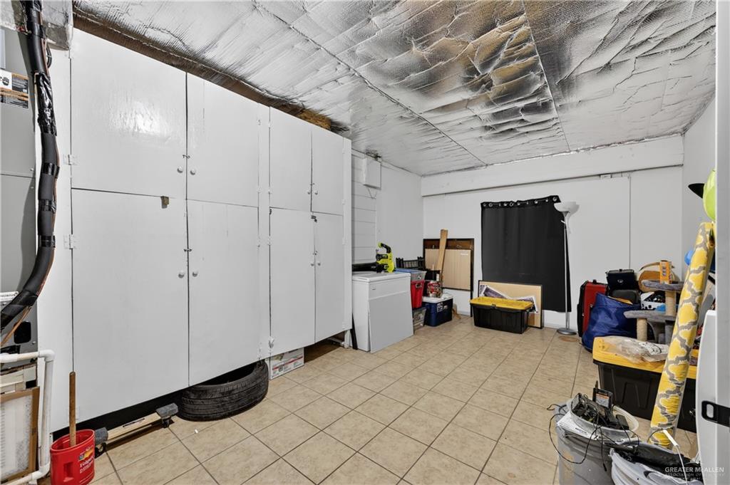 616 5th Street Weslaco, TX 78596 - Photo 25 of 33 a view of a storage & utility room with furniture and a window