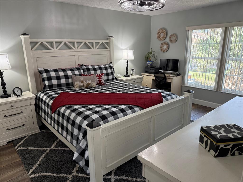 6527 Spring Flower Drive, Unit 21 New Port Richey, FL 34653 - Photo 12 of 21 a bedroom with a bed and window