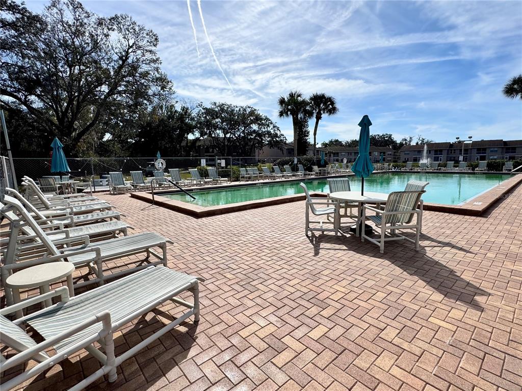 6527 Spring Flower Drive, Unit 21 New Port Richey, FL 34653 - Photo 17 of 21 a view of a lake with outdoor seating