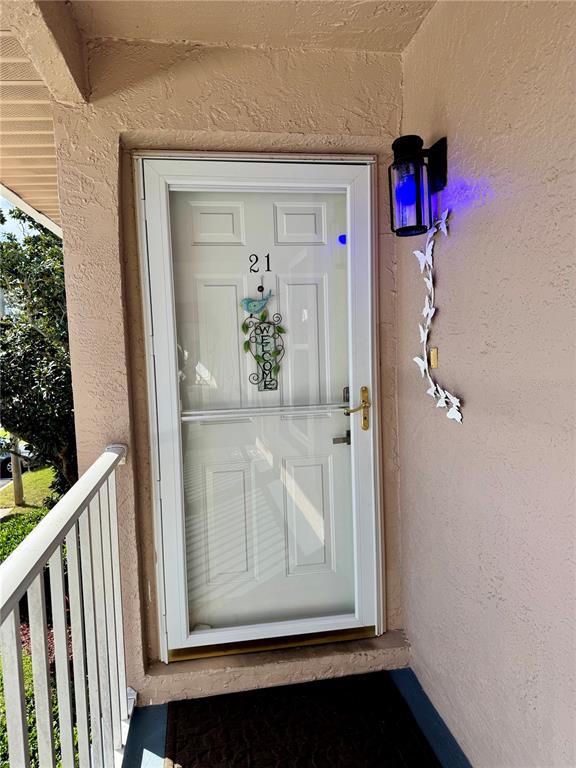 6527 Spring Flower Drive, Unit 21 New Port Richey, FL 34653 - Photo 2 of 21 a view of a hallway with wooden floor and closet