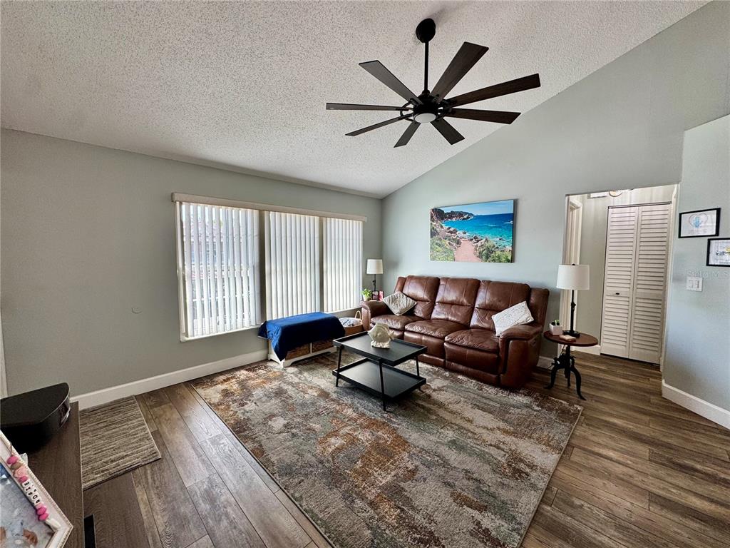 6527 Spring Flower Drive, Unit 21 New Port Richey, FL 34653 - Photo 6 of 21 a living room with furniture and a window