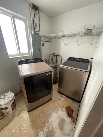 a utility room with dryer and washer