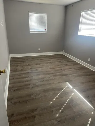 a view of a small space with wooden floor