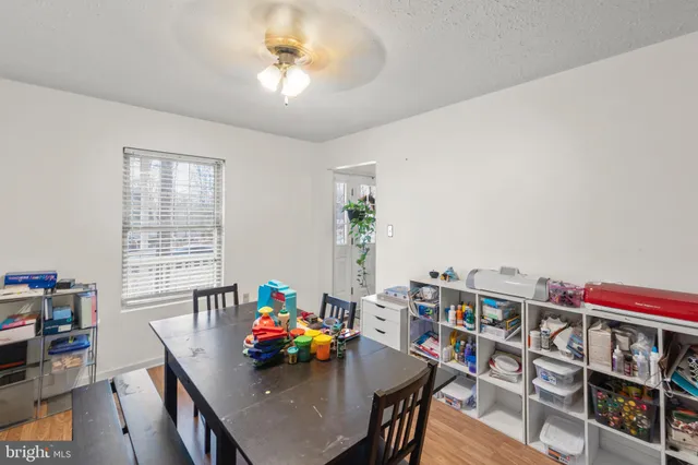 a living room with furniture a rug and a window