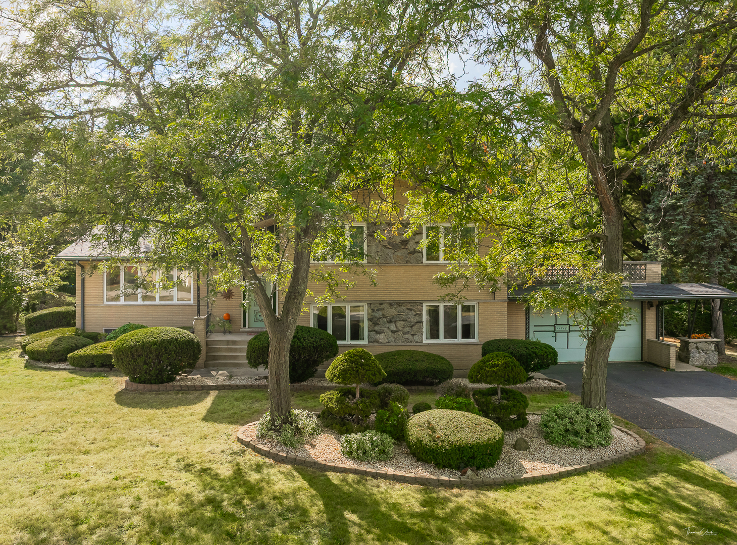11716 Center Drive Lemont, IL 60439 - Photo 2 of 6 a view of a couches in the patio with a fire pit