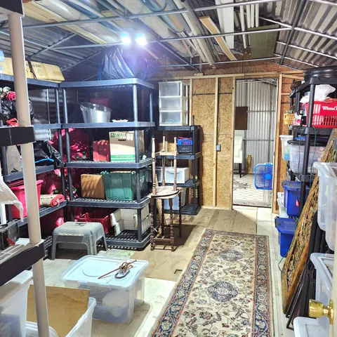 a room with lots of different furniture and a chandelier