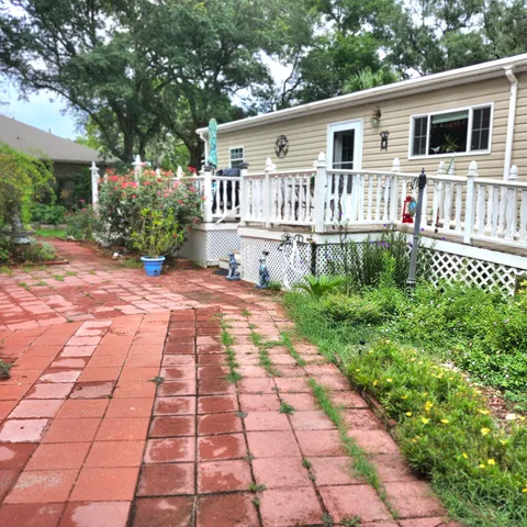 a living room with furniture and a mirror