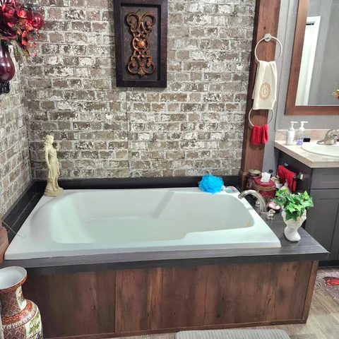 a bathroom with a sink vanity and a mirror