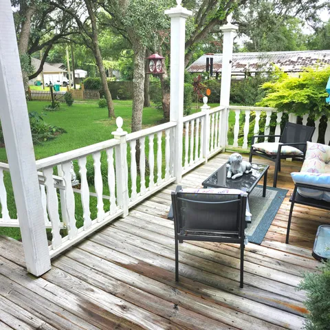 a front view of house with a garden