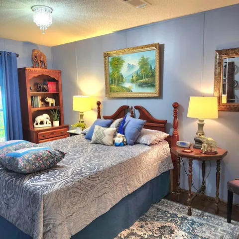 a bedroom with bed and window