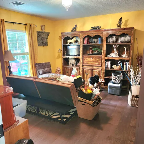 a outdoor living space with furniture and a fireplace