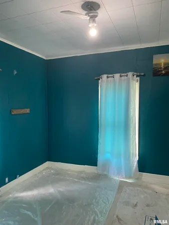 a view of a big room with closet and cabinetry