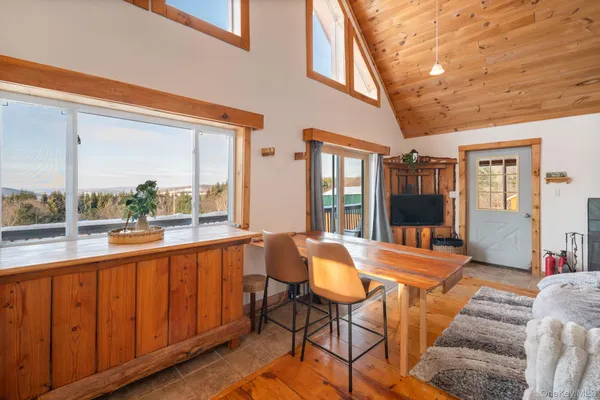 a view of a living room and a large window