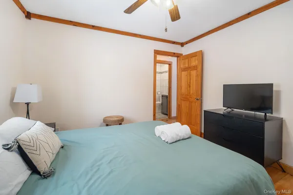 a bedroom with a bed and a couch