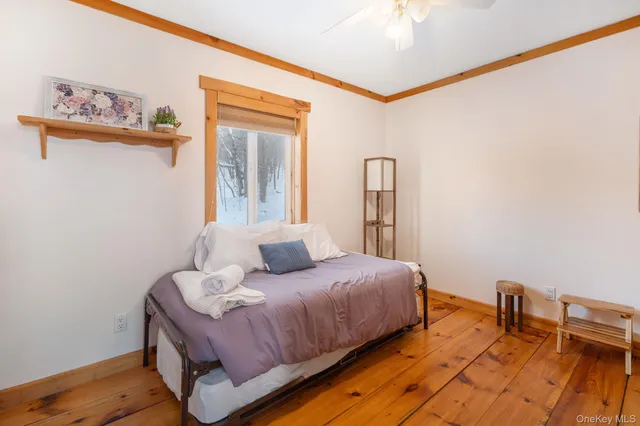 a bedroom with a bed and a table in it