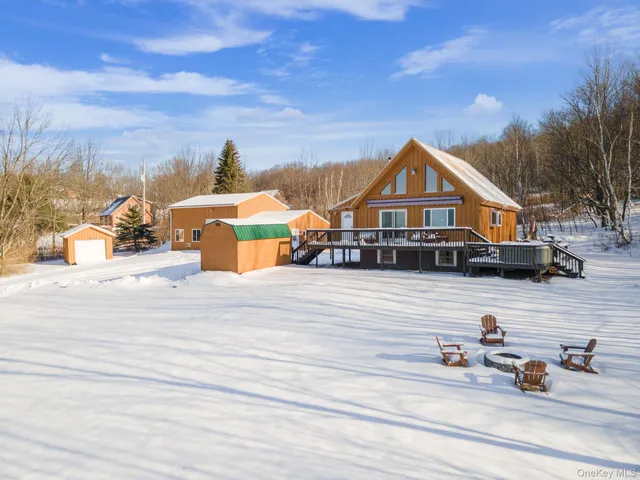 a view of a house next to a yard