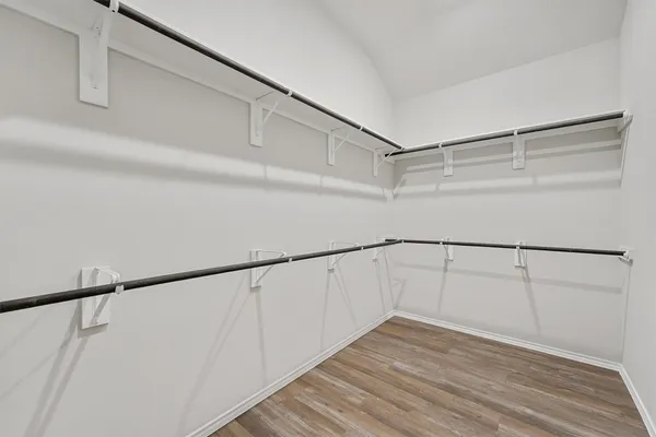 a view of an empty walk in closet