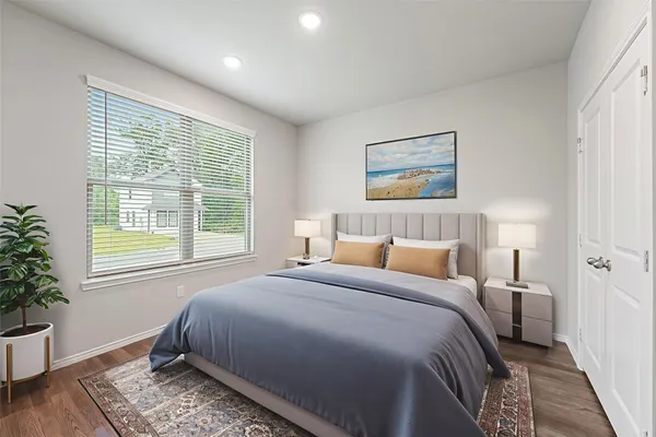 a bedroom with bed and a window