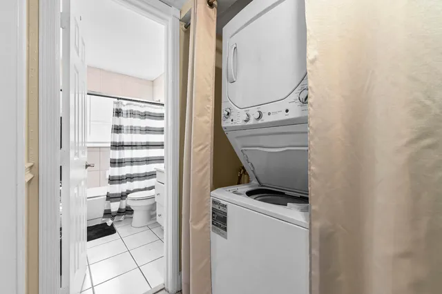 a bathroom with a toilet and a mirror
