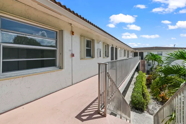 a front view of a house with a yard from a balcony