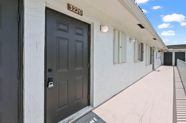 a view of a hallway with the front door