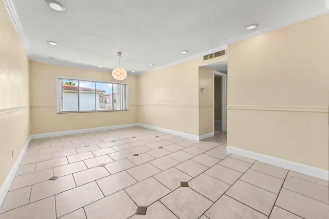 a view of an empty room and window